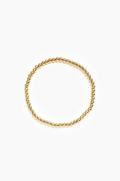 CrownLuxe armband – elegant gouden kralenontwerp met een koninklijke charme. Een verfijnd accessoire dat perfect is voor elke gelegenheid en een vleugje luxe toevoegt aan uw look