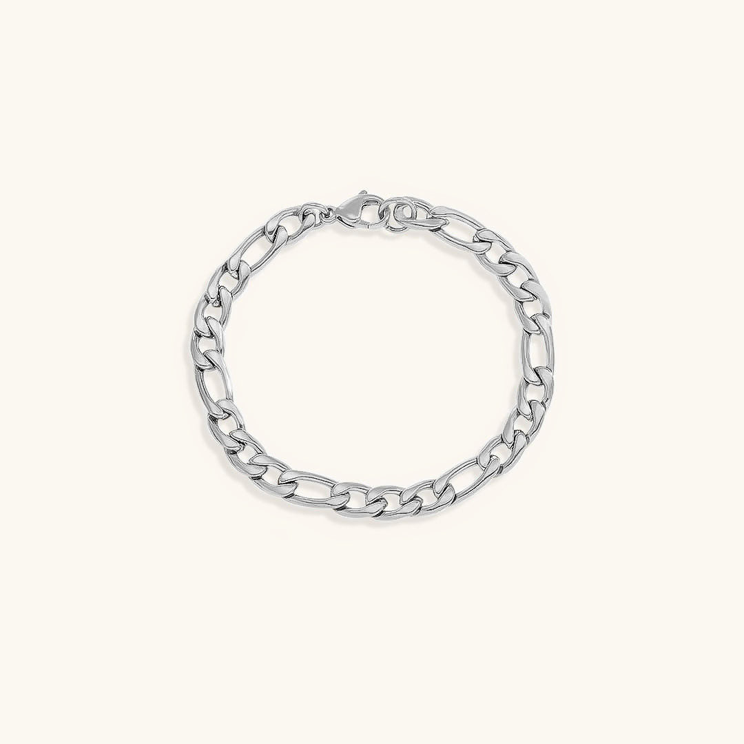 Lusso Vero armband met een robuuste zilveren schakelketting, minimalistisch gepresenteerd op een crèmekleurige achtergrond. Een elegante en tijdloze accessoire voor elke gelegenheid.