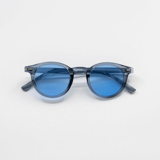 Storm | Zonnebril met blauwe glazen | Transparant grijs montuur
